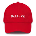 Red adjustable cotton baseball cap with BELIEVE front embroidery
