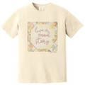 Ivory crewneck T-shirt with front graphic: 'live a good story'