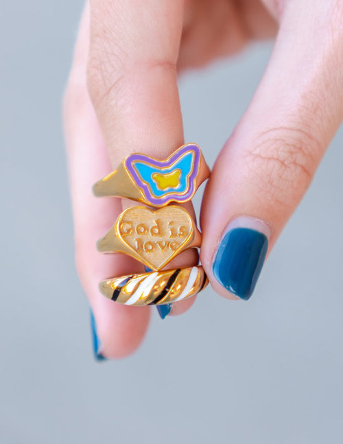 Blue enamel butterfly ring with gold butterfly center on a gold band