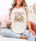 Cream crewneck T-shirt with Chicken Raising Jesus Praying print, chicken and floral pumpkin