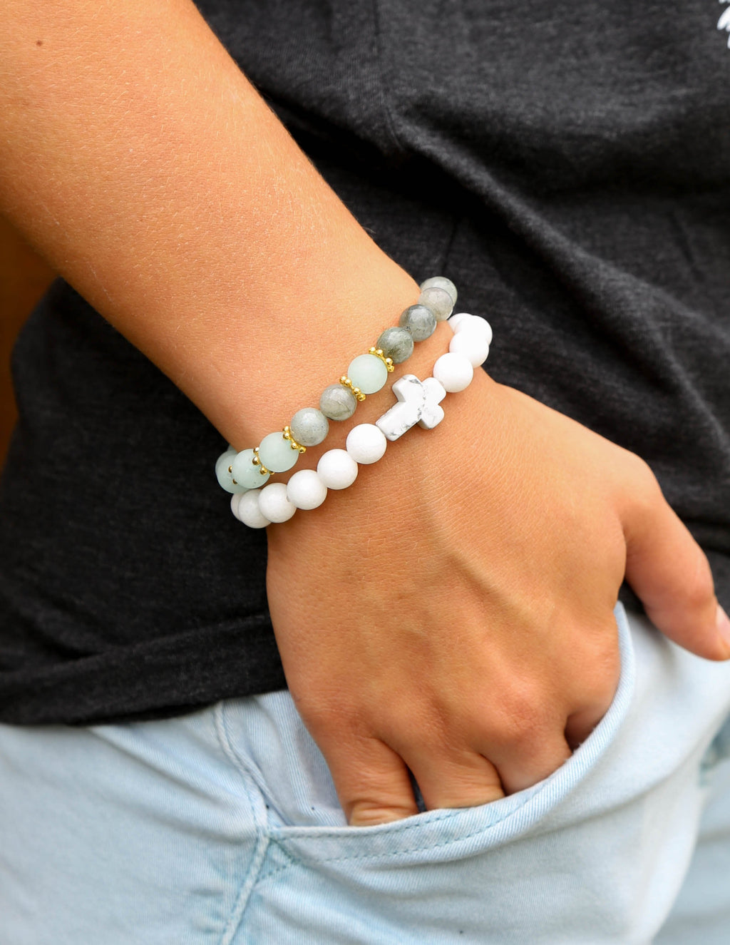 Beaded cross charm bracelet with white and light blue beads