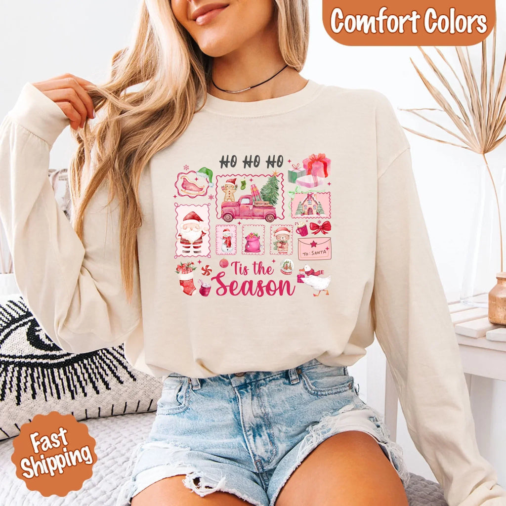 Ivory long sleeve Christmas shirt worn with blue denim, featuring "Ho Ho Ho" "Tis the Season" art