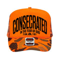 Neon orange foam trucker cap with camo mesh and bold CONSECRATED front logo