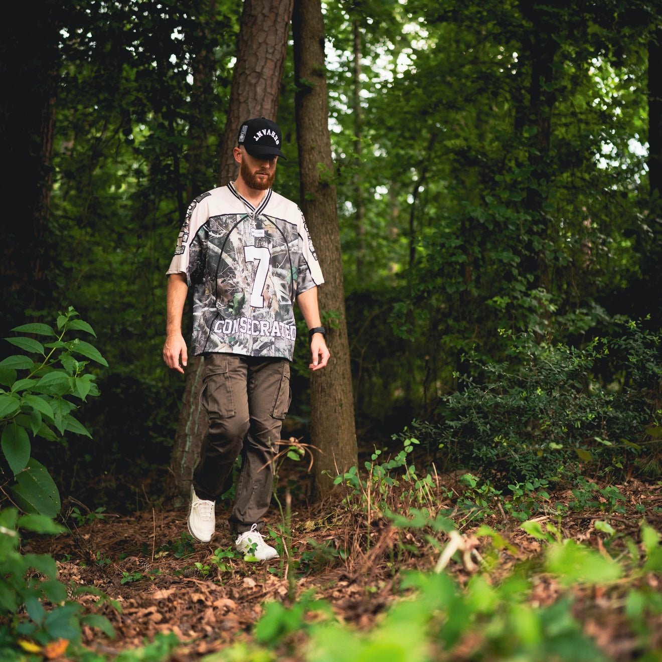 Oversized jersey front view with woodland camo number 7 graphic and cream accents