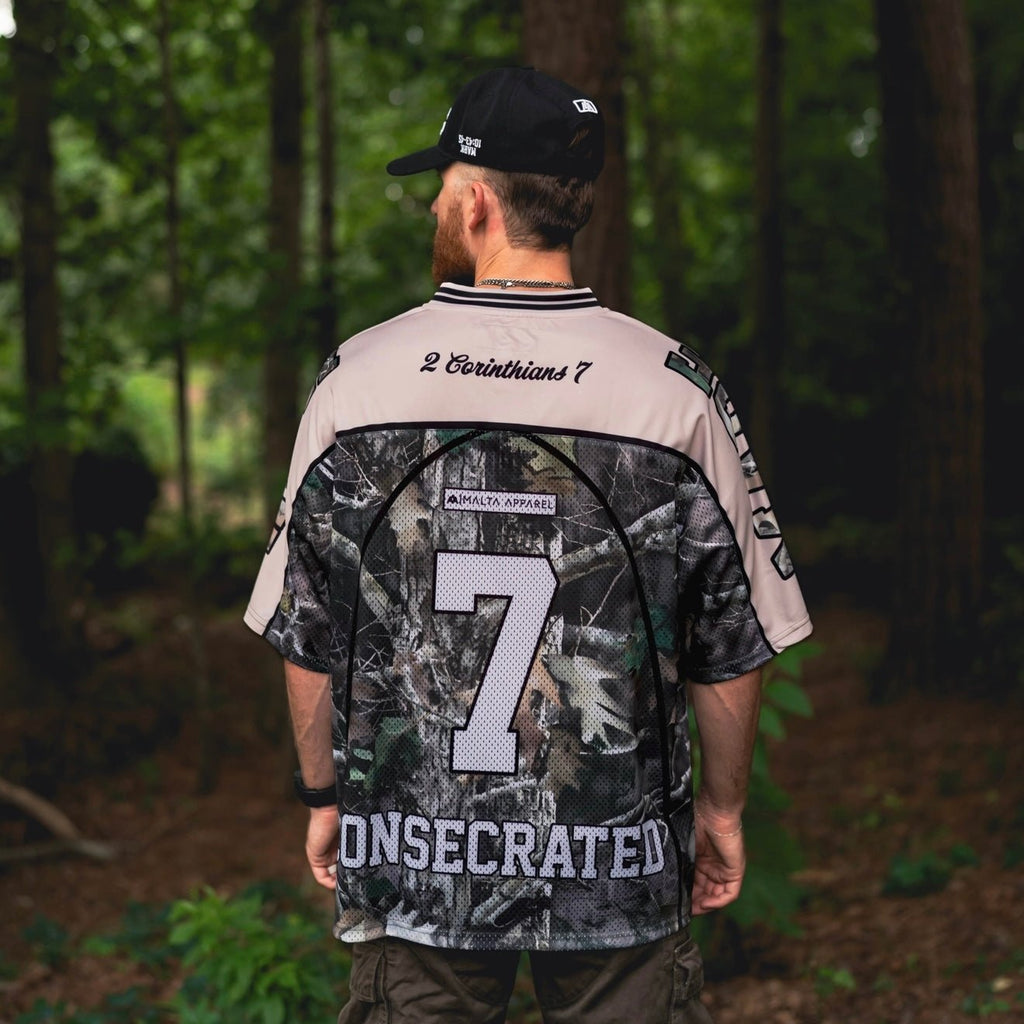 Oversized jersey back view with woodland camo pattern, number 7 and CONSECRATED