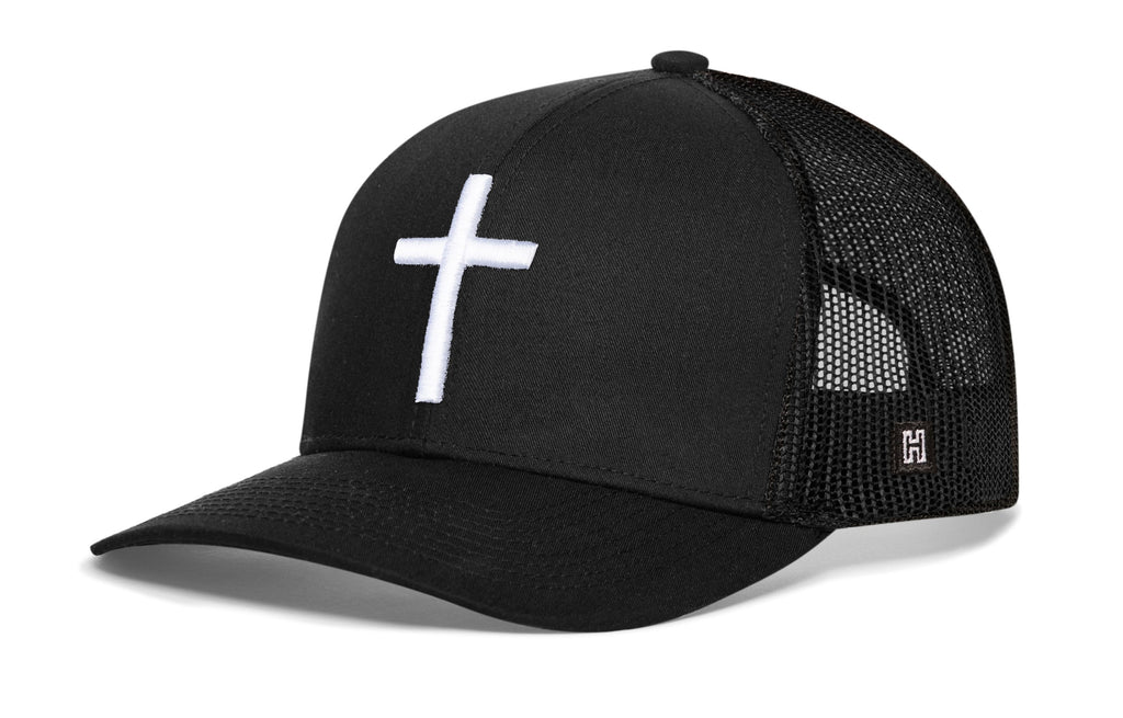 Black cross trucker hat with white cross logo and black mesh back