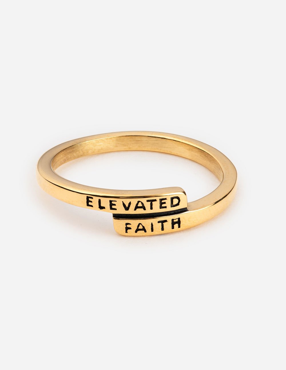Gold-tone ring engraved 'ELEVATED FAITH' on band