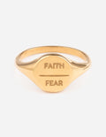 Gold-tone Faith and Fear signet ring with open band and engraved words on top