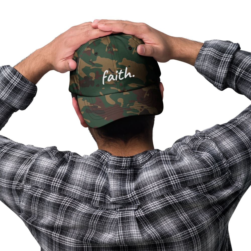 Green camo baseball cap with embroidered 'faith' front logo.