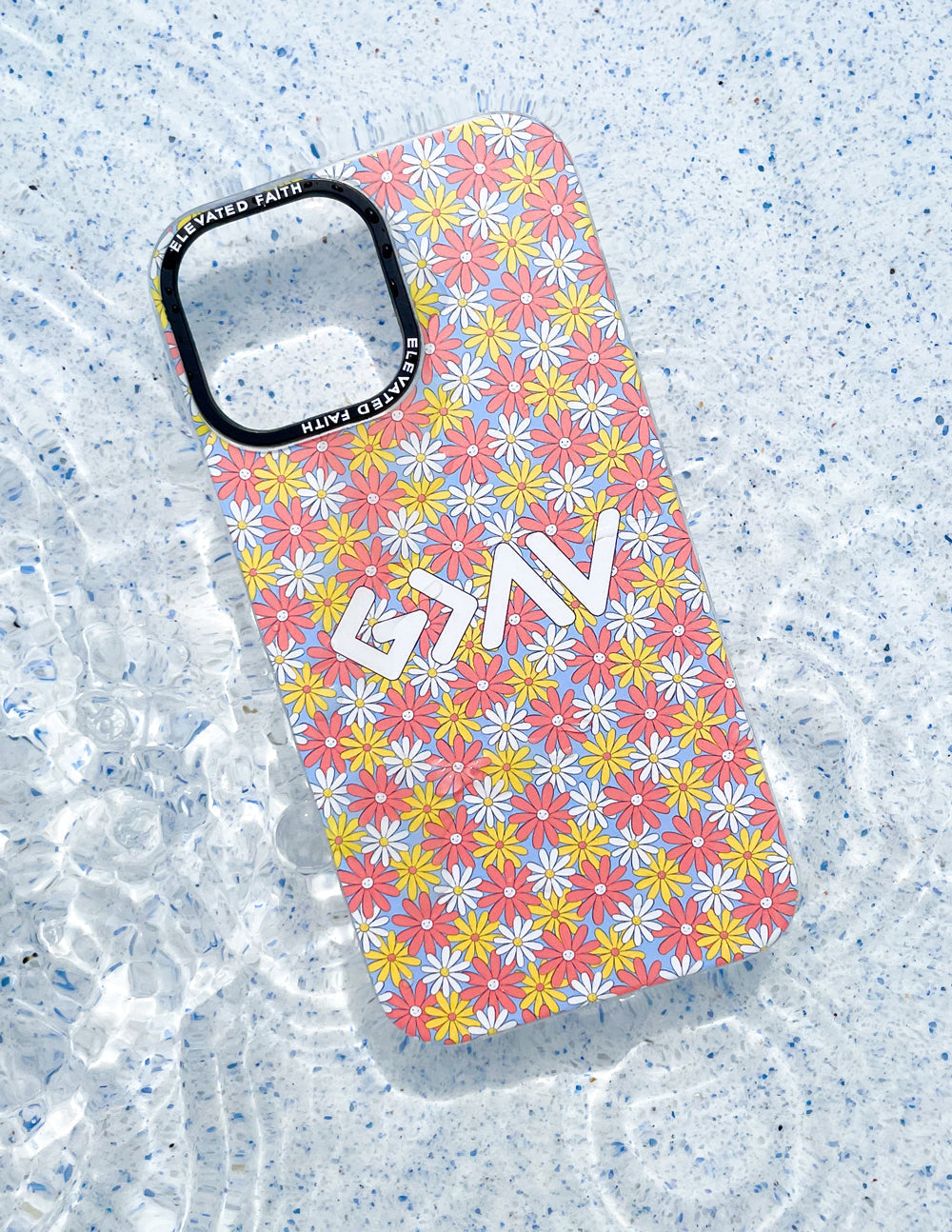 Floral phone case, pink with multicolor daisy pattern and raised GM decal