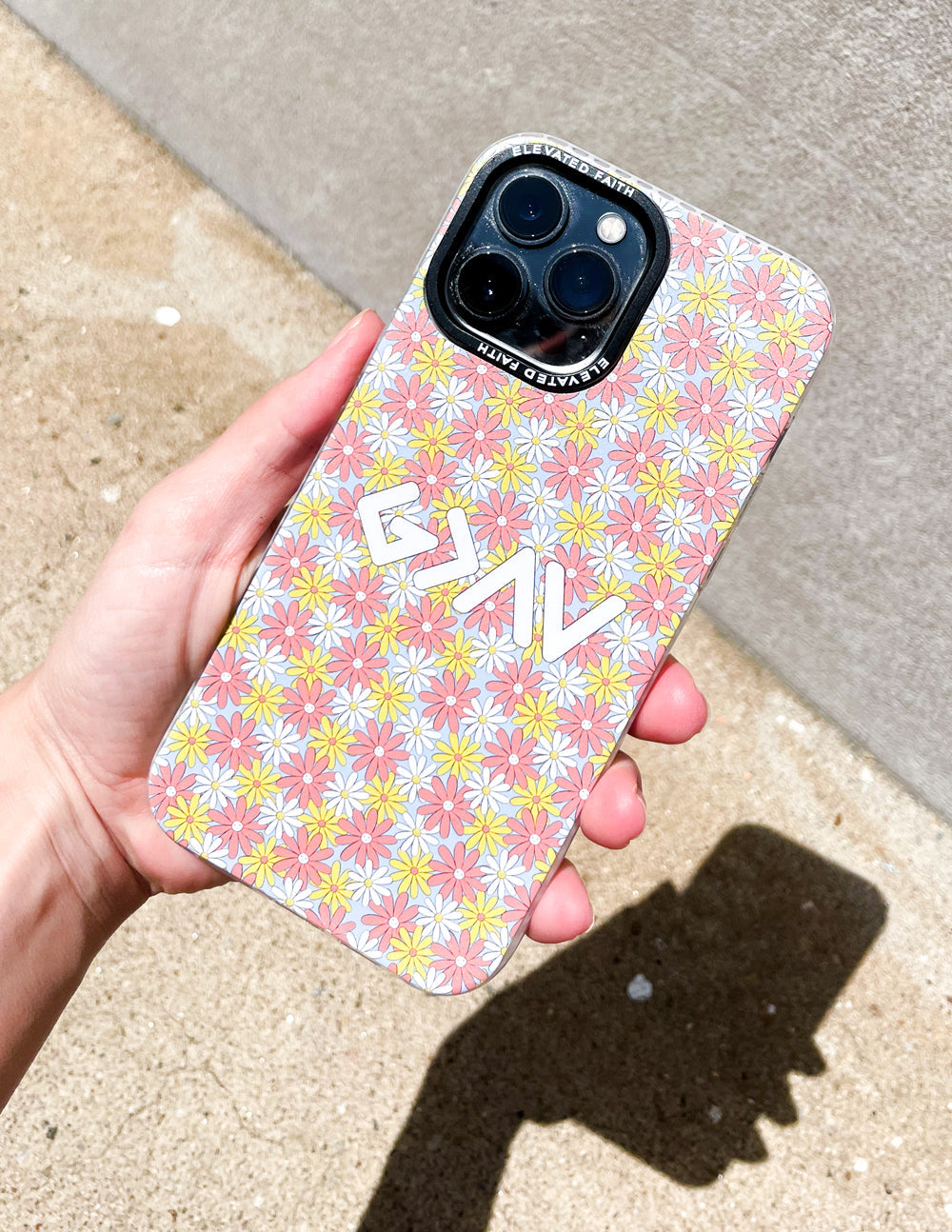 Floral phone case with pink daisy pattern, dual camera cutouts, GM graphic