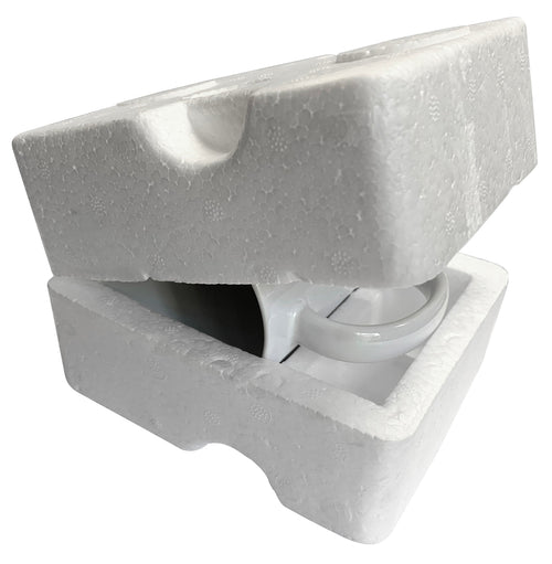 Foam packaging insert holding a mug with handle and spout cutouts