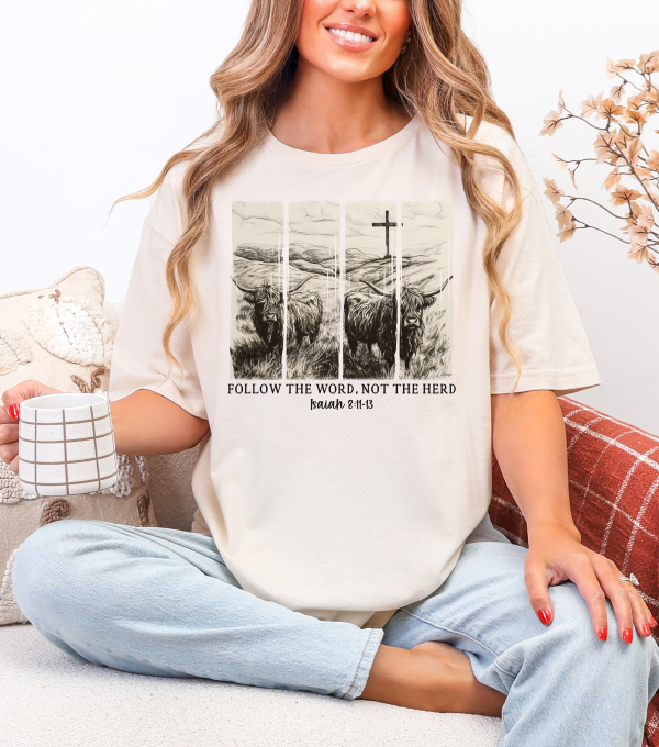 Natural t-shirt with Highland cow graphic and 'FOLLOW THE WORD, NOT THE HERD' print