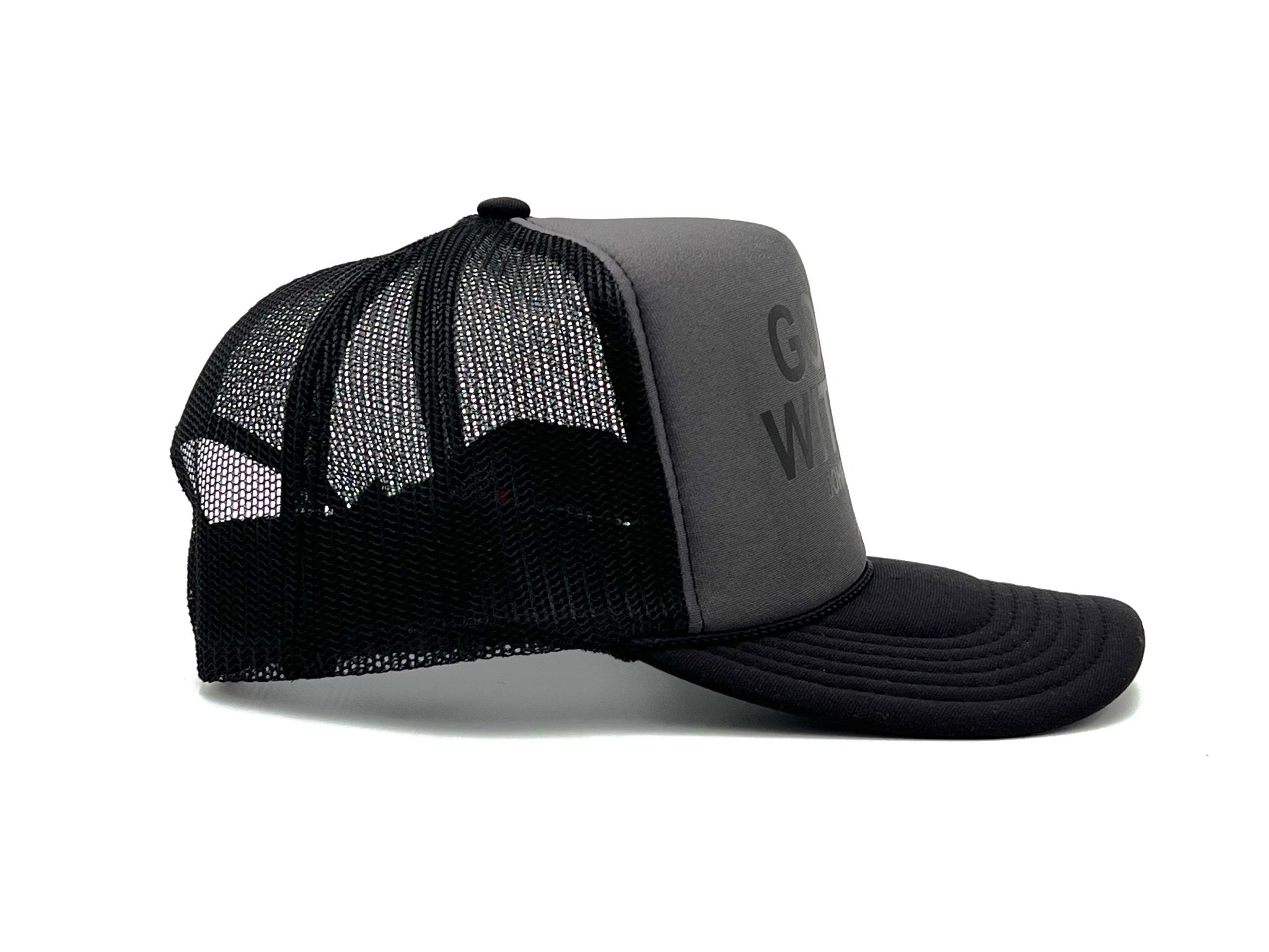Charcoal and black trucker cap, front text on foam panel with mesh side panels