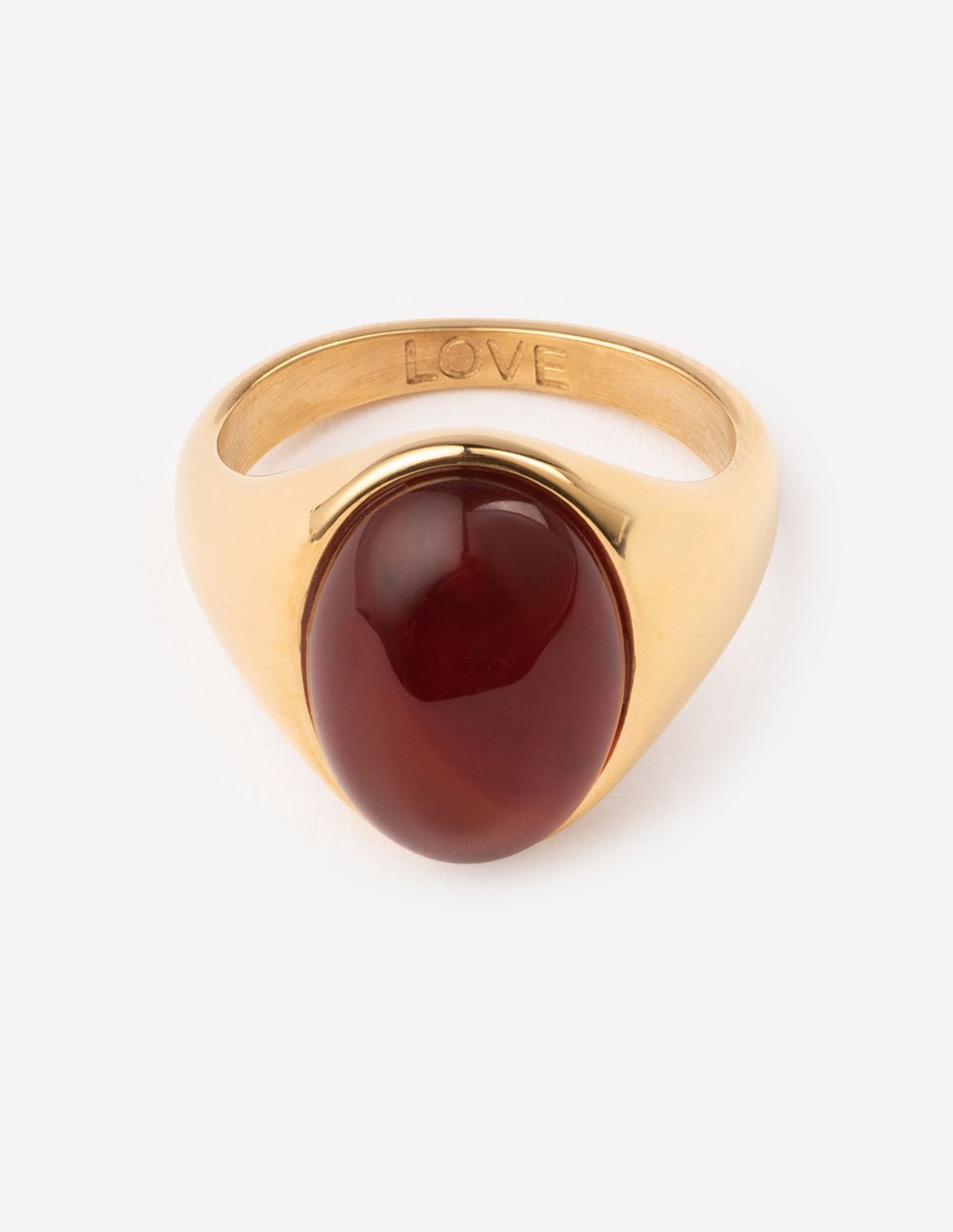Gold-tone love ring with dark red teardrop cabochon and LOVE engraving on band