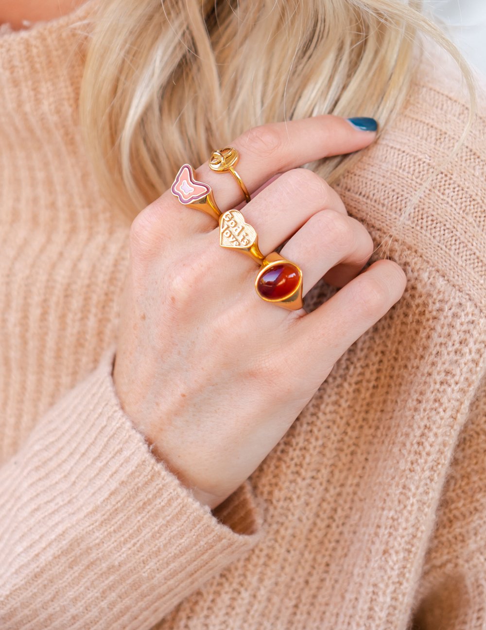 Gold-tone heart and gemstone rings with red cabochon and pink heart enamel