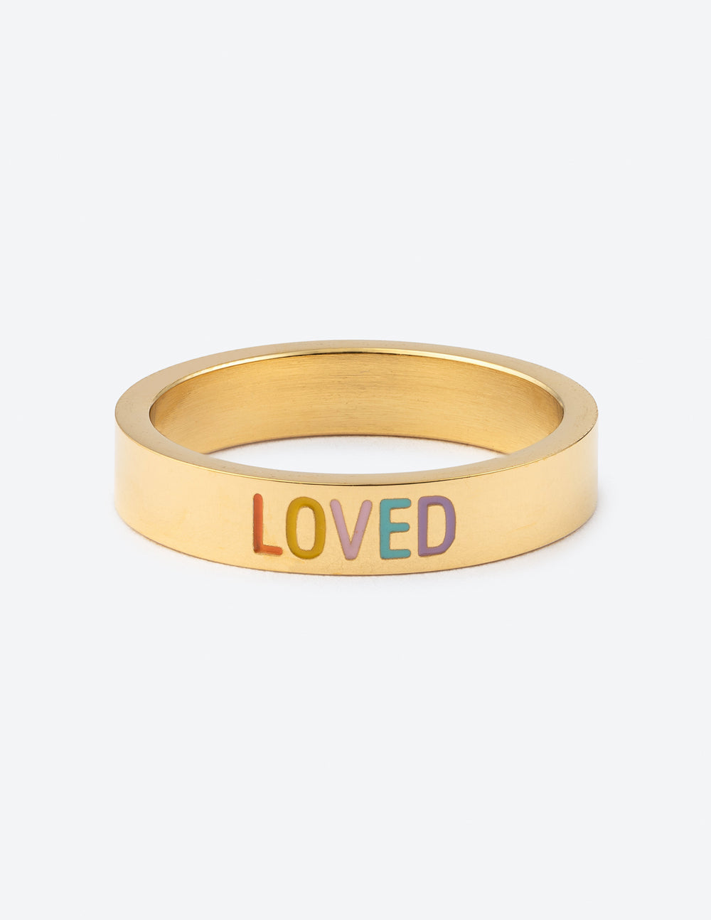 Gold statement ring with raised "LOVED" lettering on wide band