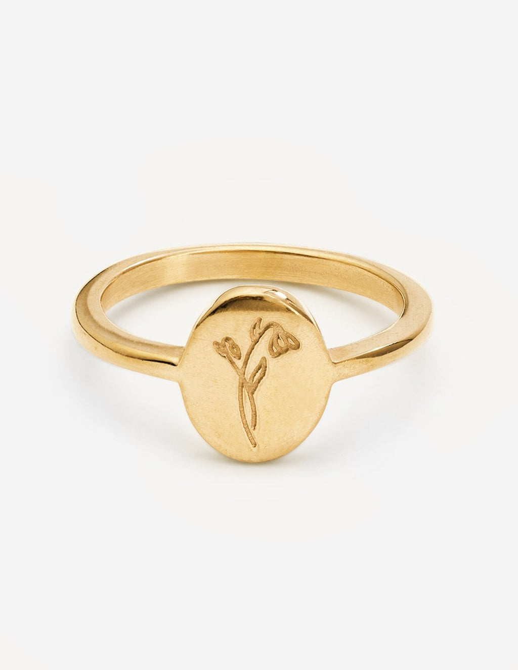 Gold wildflower signet ring with thin band and small floral engraving on round face