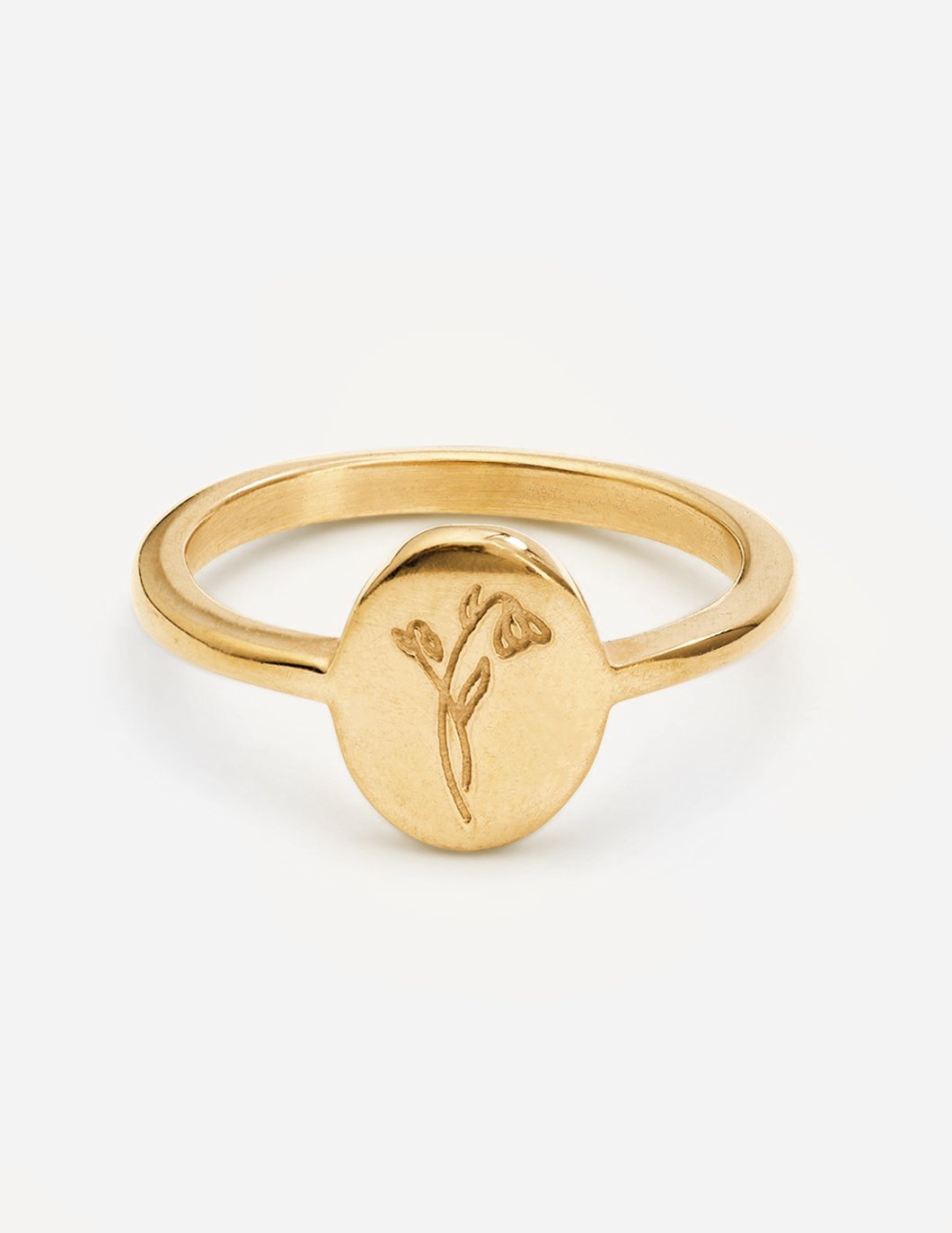 Gold wildflower signet ring with thin band and small floral engraving on round face