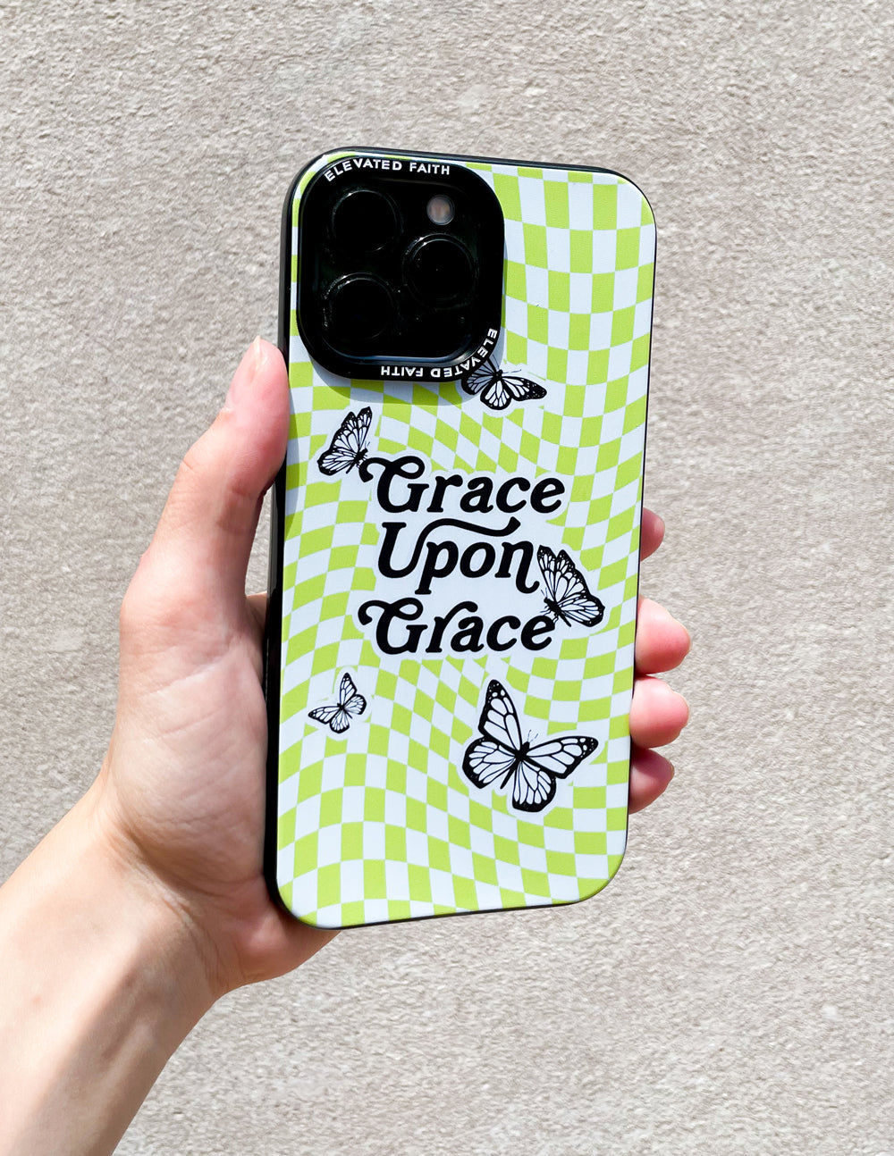 Lime green checkered phone case with butterfly graphics and camera cutout
