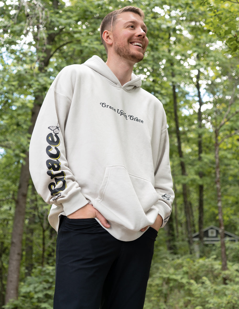 Cream unisex hoodie with hood, front pocket, small script logo and butterfly print
