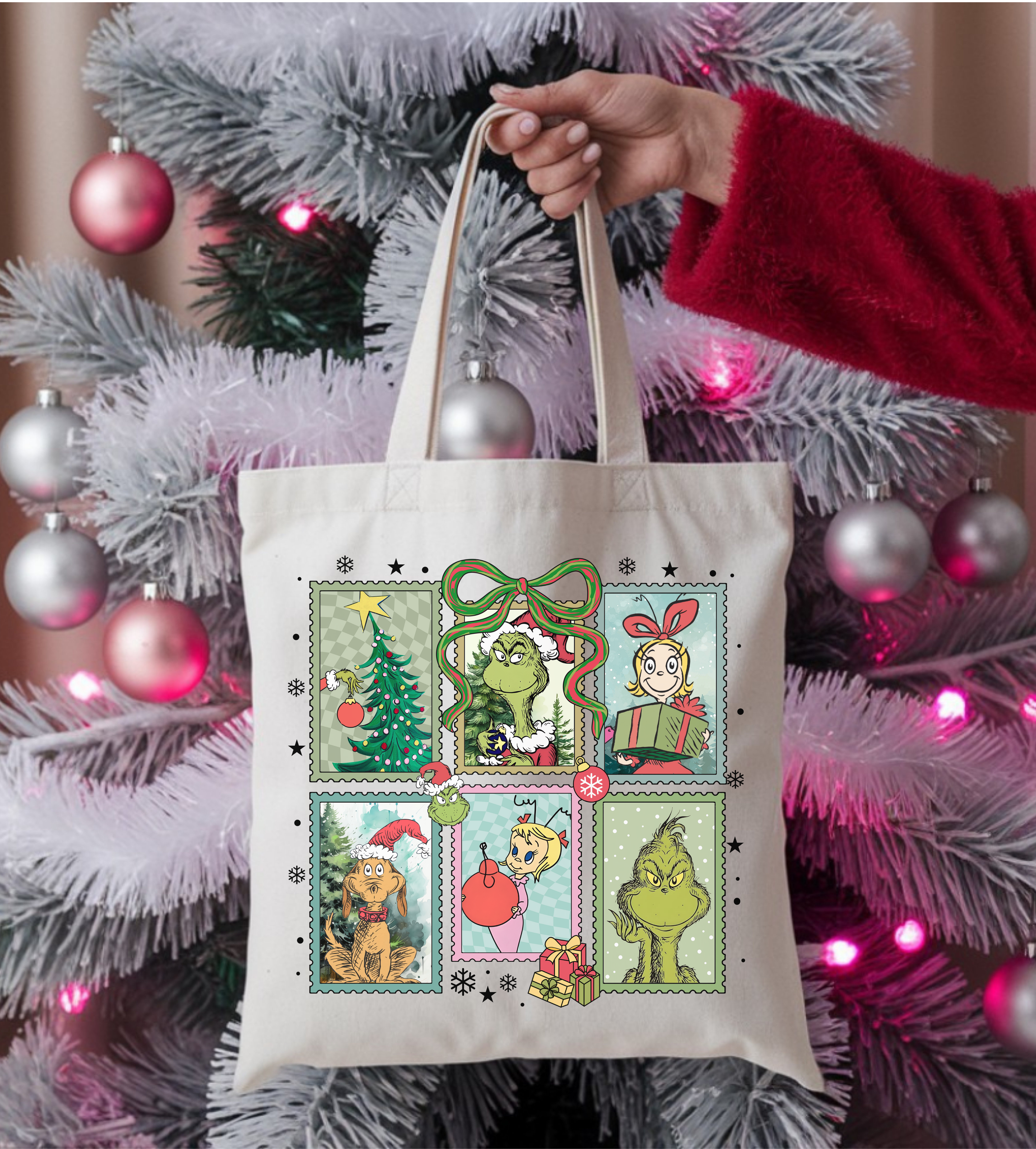 Cream canvas Christmas tote bag with green cartoon character and holiday stickers, top handles