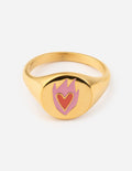 Gold-tone heart signet ring with pink heart enamel in a flame-shaped crest