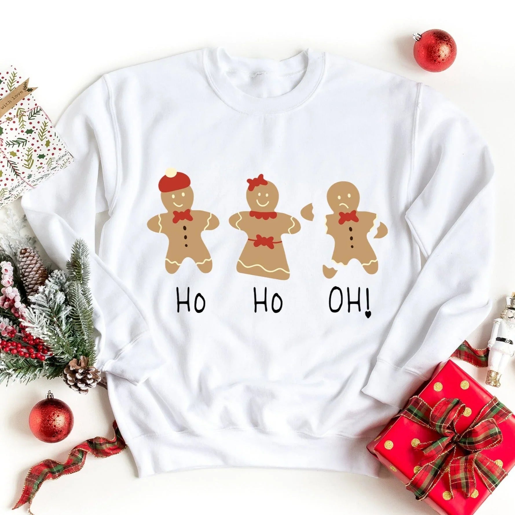 White crewneck sweatshirt with gingerbread trio graphic and Ho Ho Oh! lettering