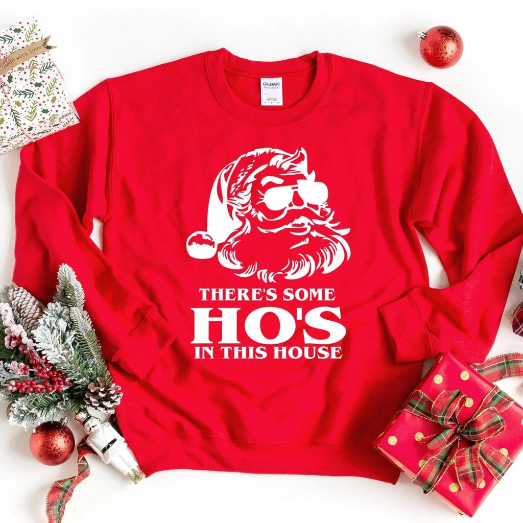 Red crewneck sweatshirt with white Santa Ho's house text