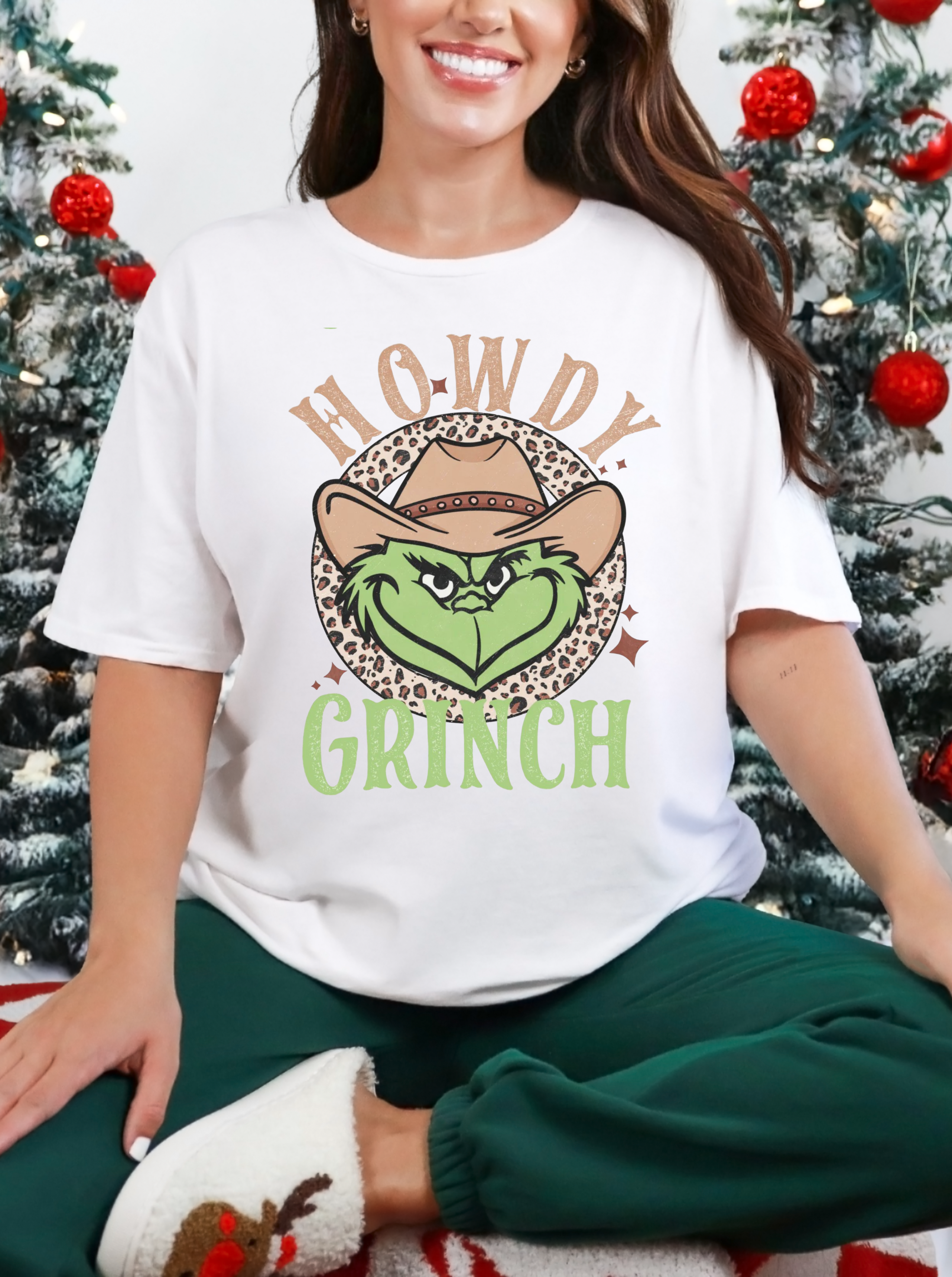 White crew-neck t-shirt with 'Howdy' Grinch face graphic, short sleeves