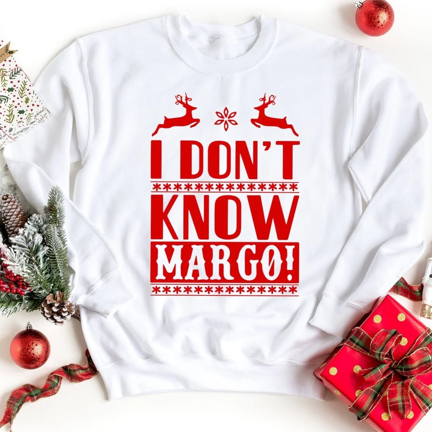 White sweatshirt with red holiday reindeer text graphic 'I DON'T KNOW MARGO!'