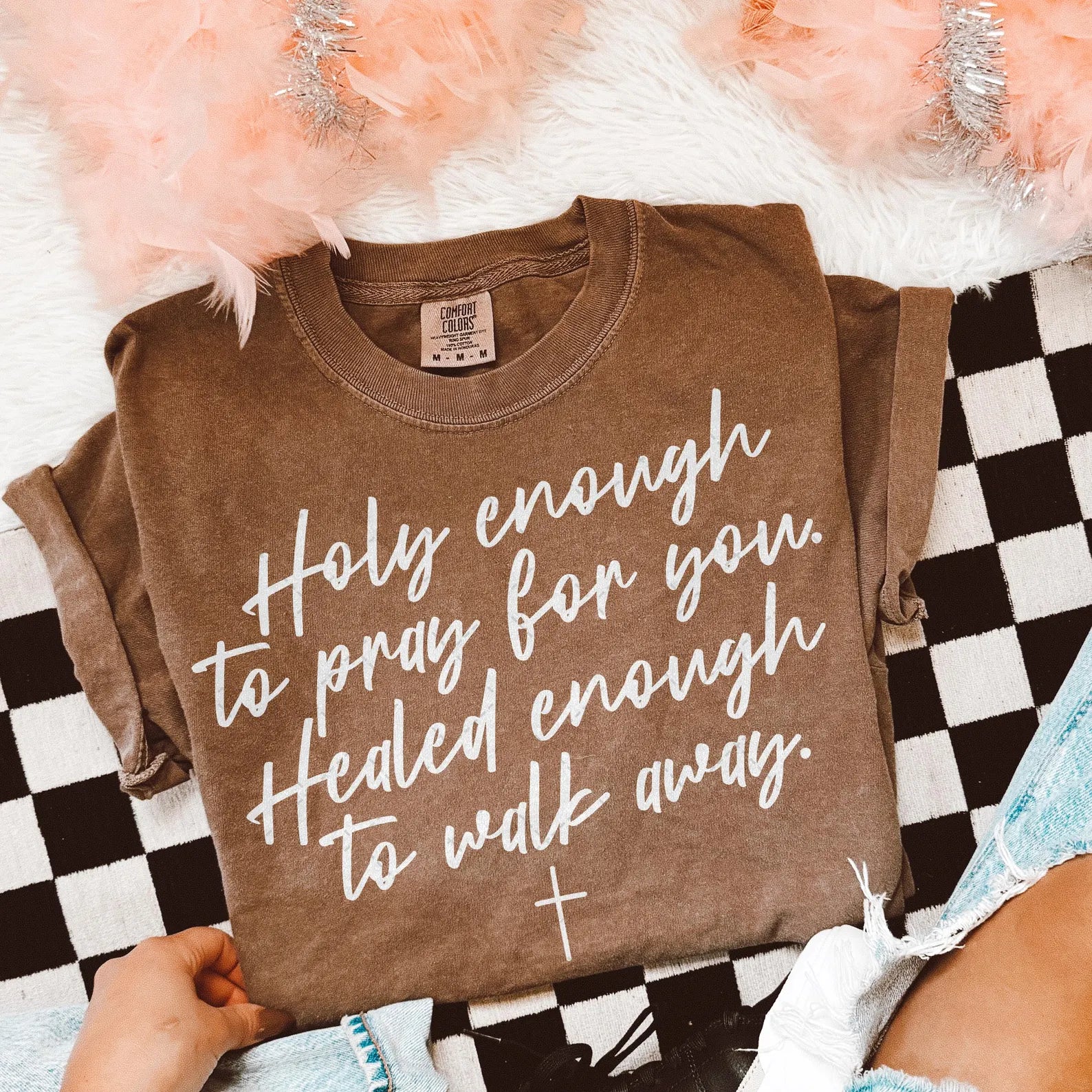 Brown graphic T-shirt with white cursive quote text: 'holy enough' 'walk away'