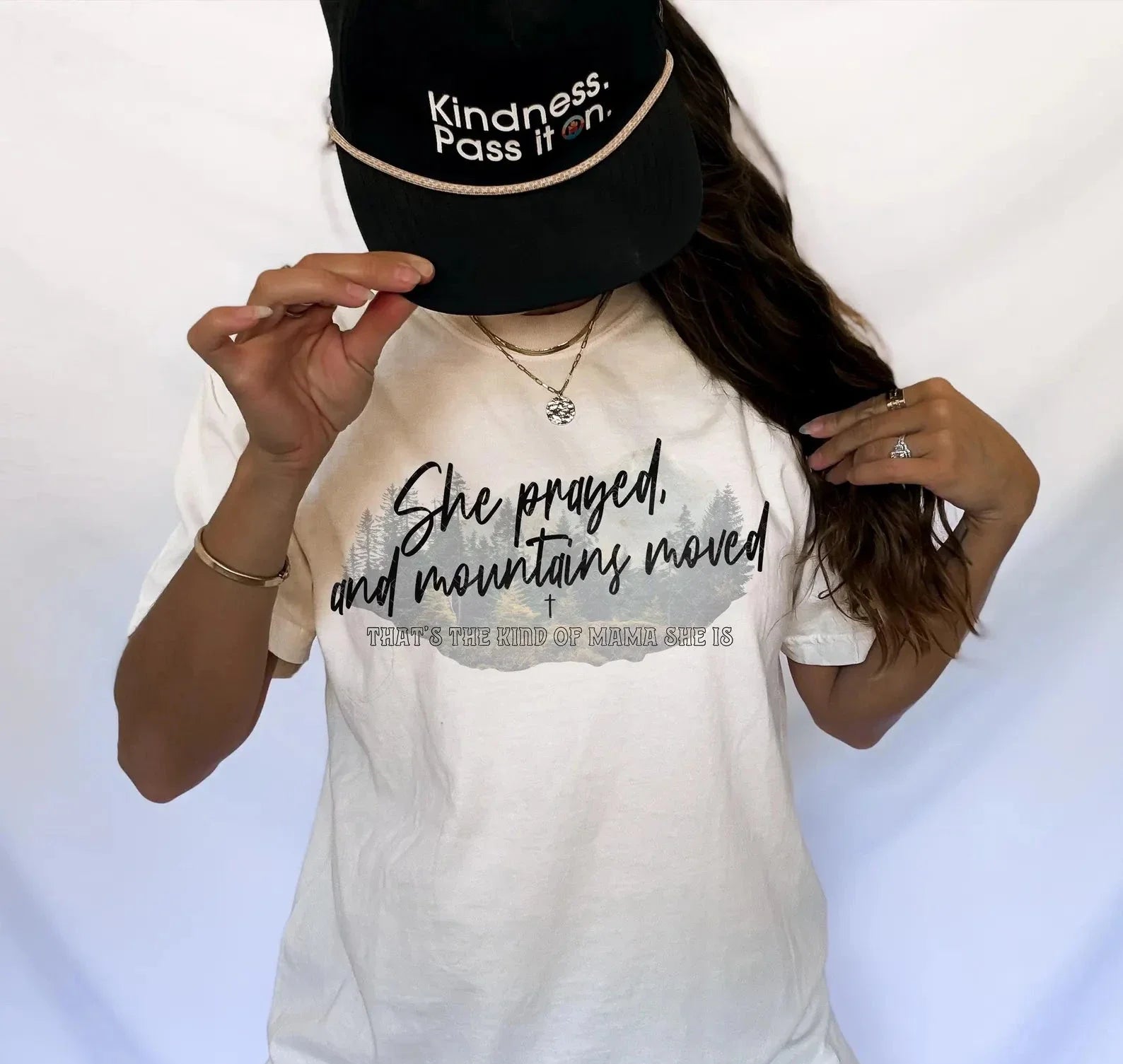 White crewneck tee with 'She prayed and mountains moved' front print