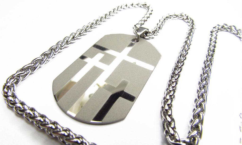 Dog tag necklace with large silver pendant featuring three cross shapes, silver chain