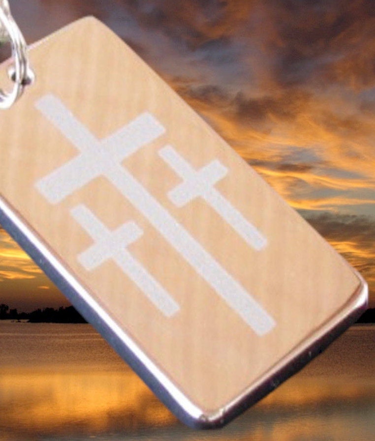 Rectangular dog tag pendant with engraved cross design and shiny metal edge