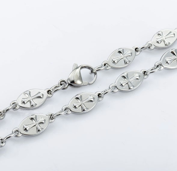 Silver chain bracelet set with raised cross oval links and connector rings