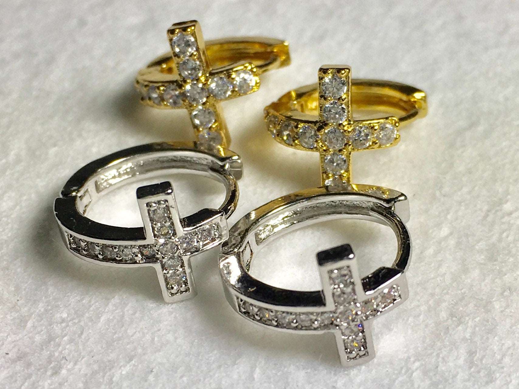 Cross hoop cuff earrings with hinged gold and silver cross charms, CZ-style stones