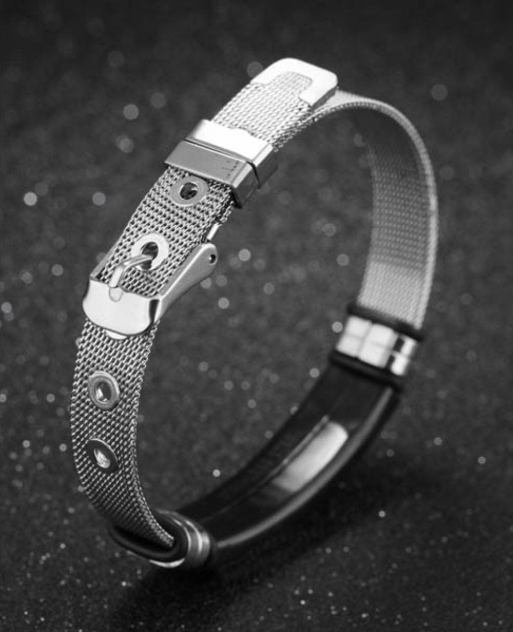 Adjustable silver mesh cross bracelet with metal buckle and black inner strap