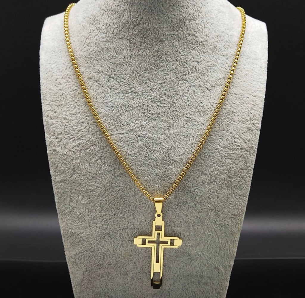 Gold cross pendant necklace on thin chain