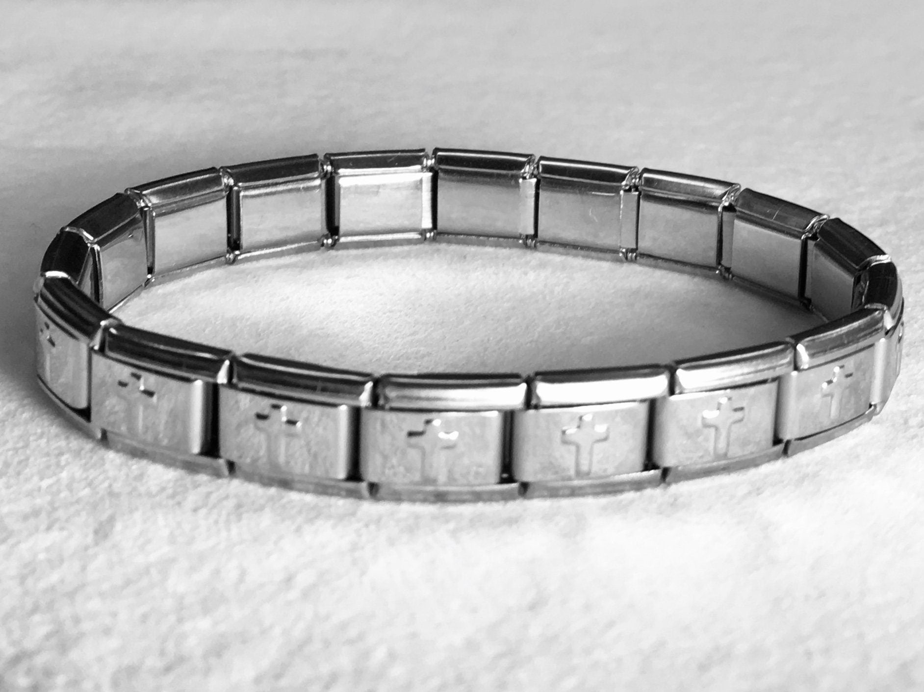 Silver stretch bracelet cuff with gold-tone cross link bars