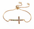 Gold-tone adjustable bracelet with colorful cz sideways cross pendant on chain
