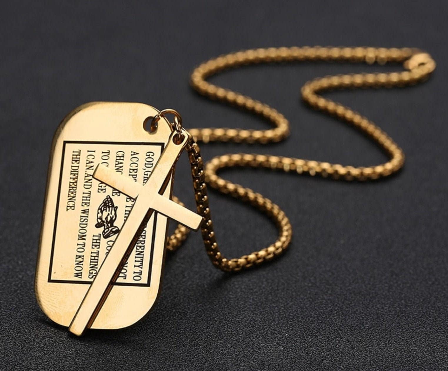 Gold dog tag serenity prayer pendant with cross, close-up on chain