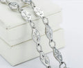 Silver chain set with raised cross oval links and lobster clasp detail