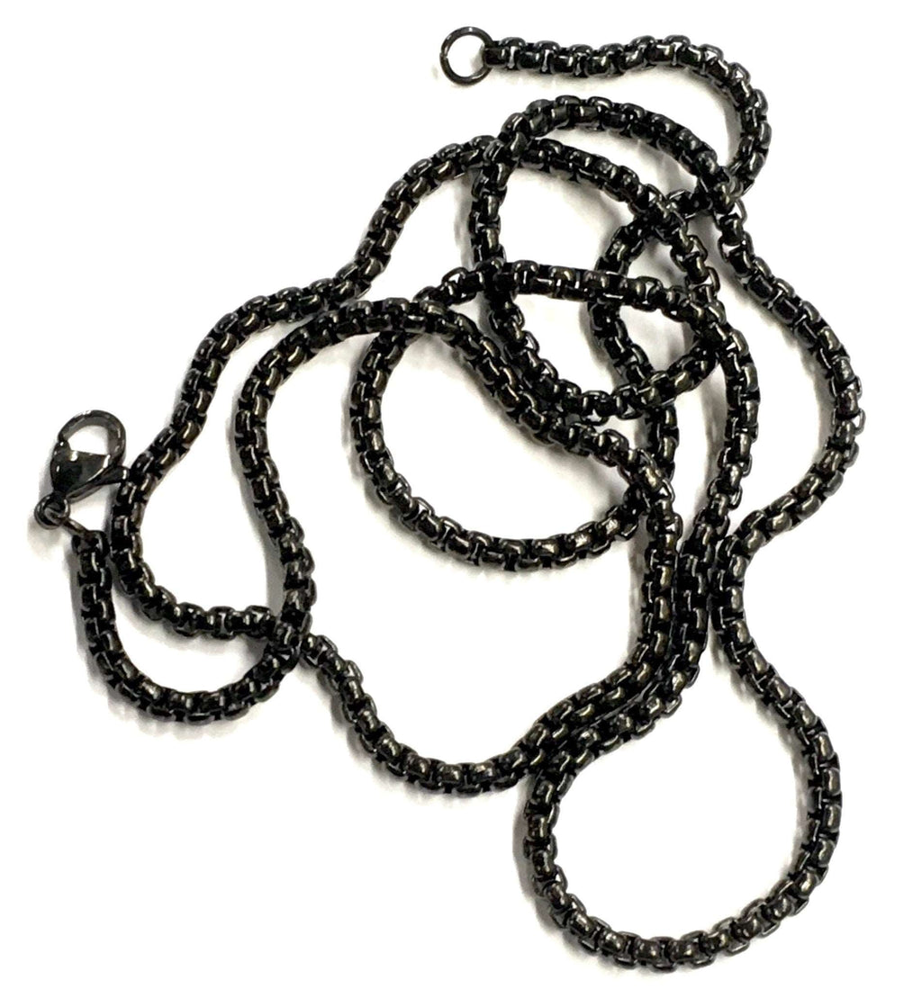 Cross necklace with black chain strands and connector link