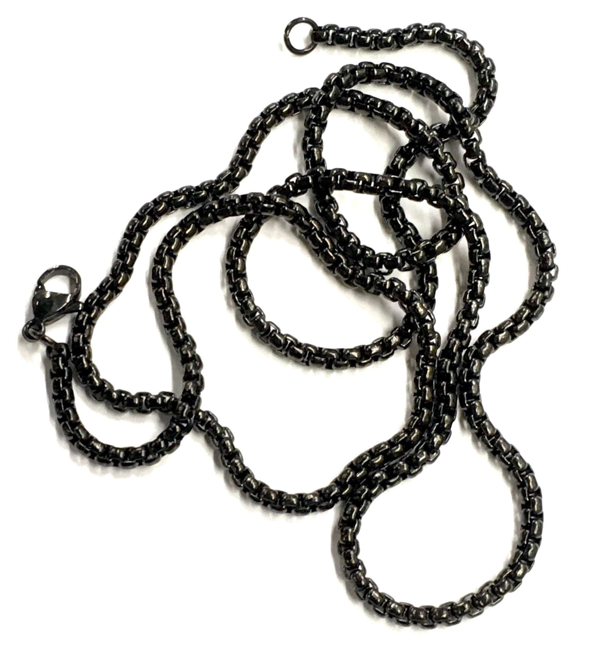 Cross necklace with black chain strands and connector link