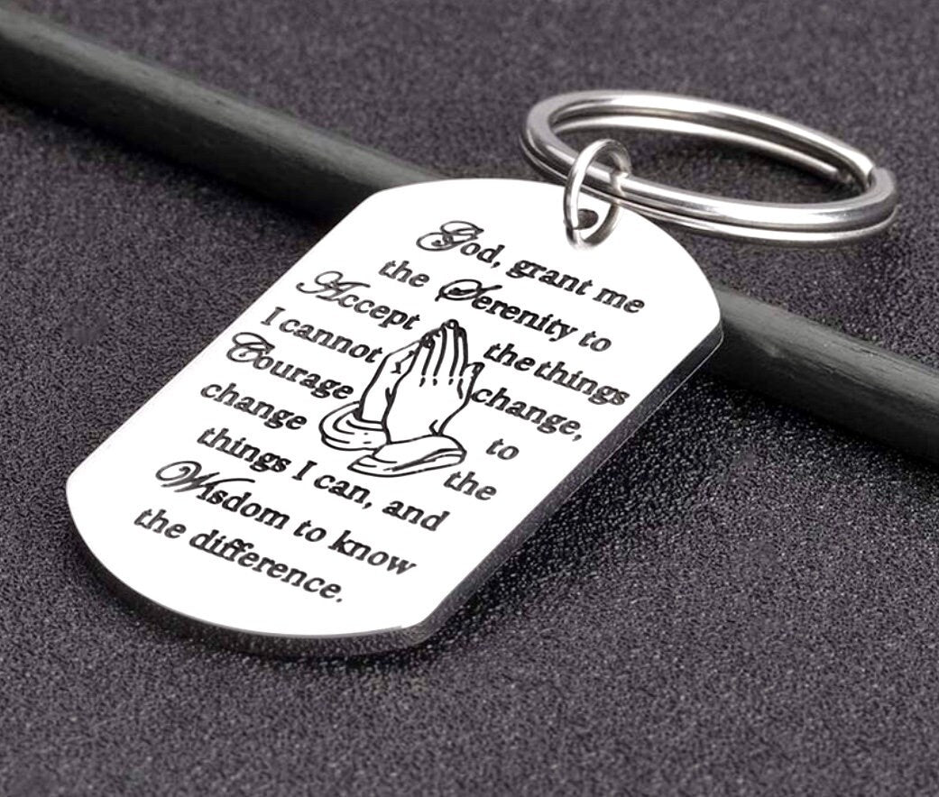Silver serenity prayer dog tag keychain with engraved quote and metal key ring.