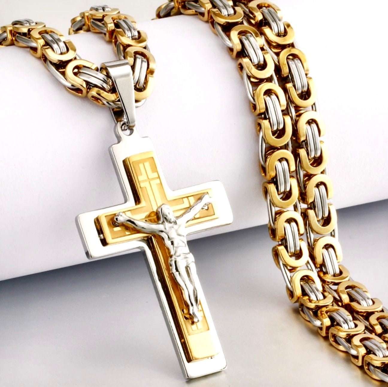 Two-tone crucifix pendant necklace with curb chain, gold and silver cross pendant