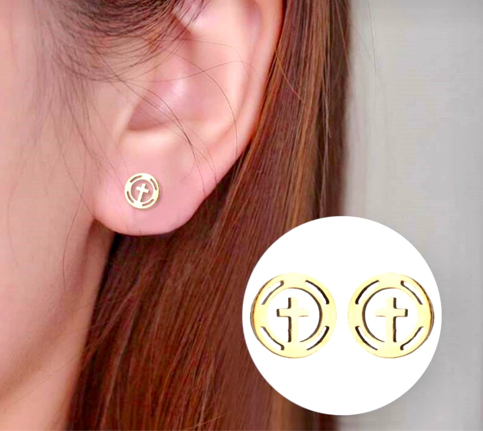 Round gold-tone cross stud earrings on ear, circular border with plus cross