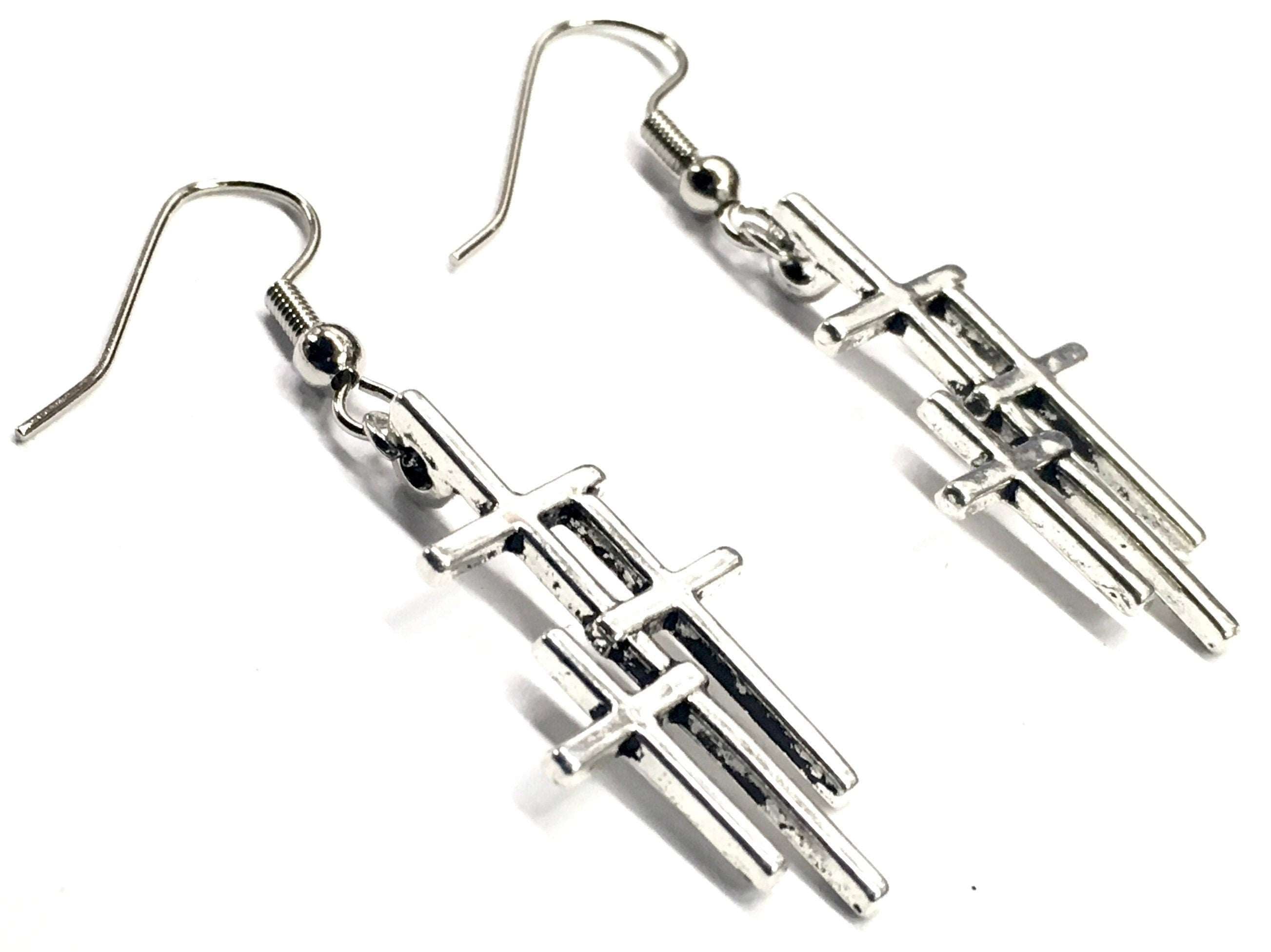 Silver triple cross drop earrings, angled view showing stacked cross bars