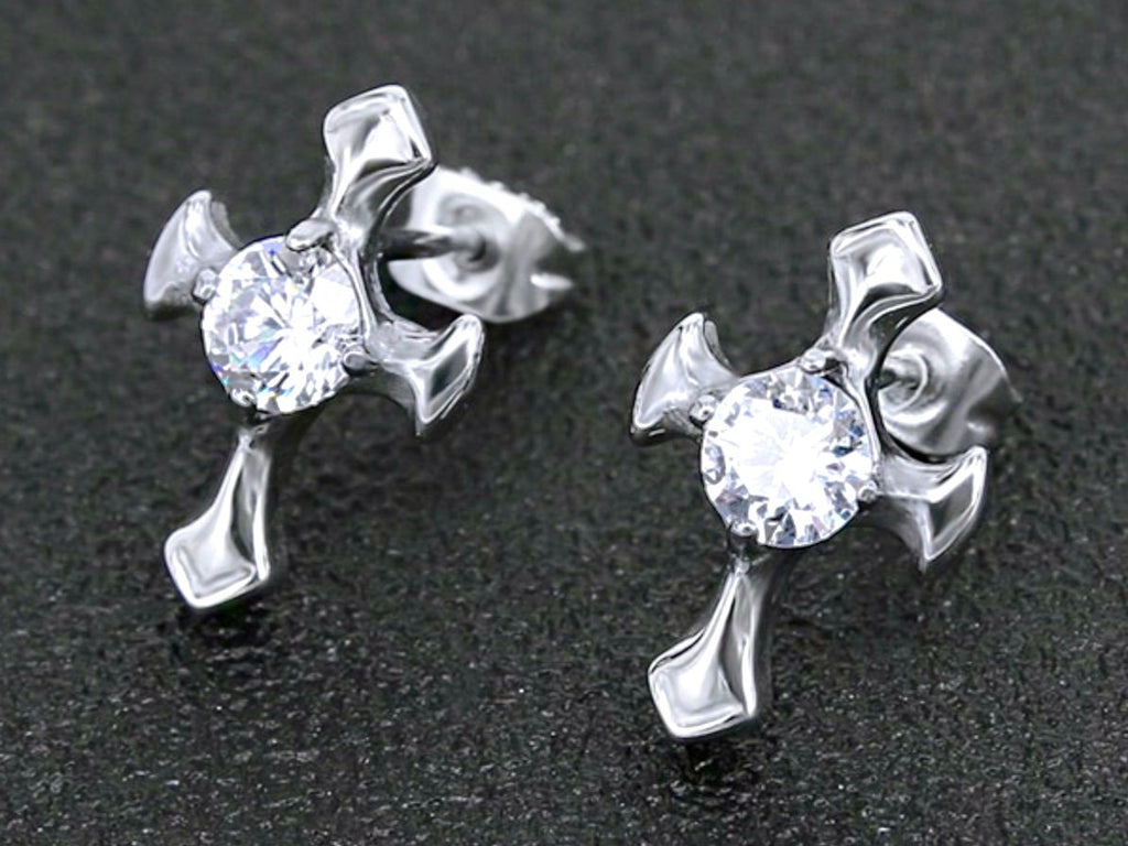 Silver zircon cross stud earrings on dark surface, front view with round center gems